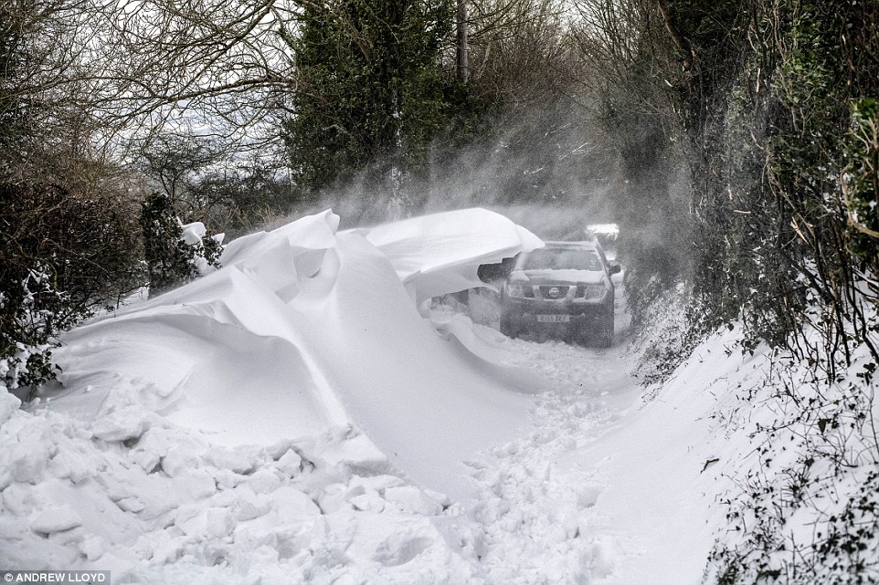 Families are ordered to EVACUATE as snow gives way to lethal rain and black ice turns UK roads into ‘death traps’ while 50mph storms continue to rage across the country